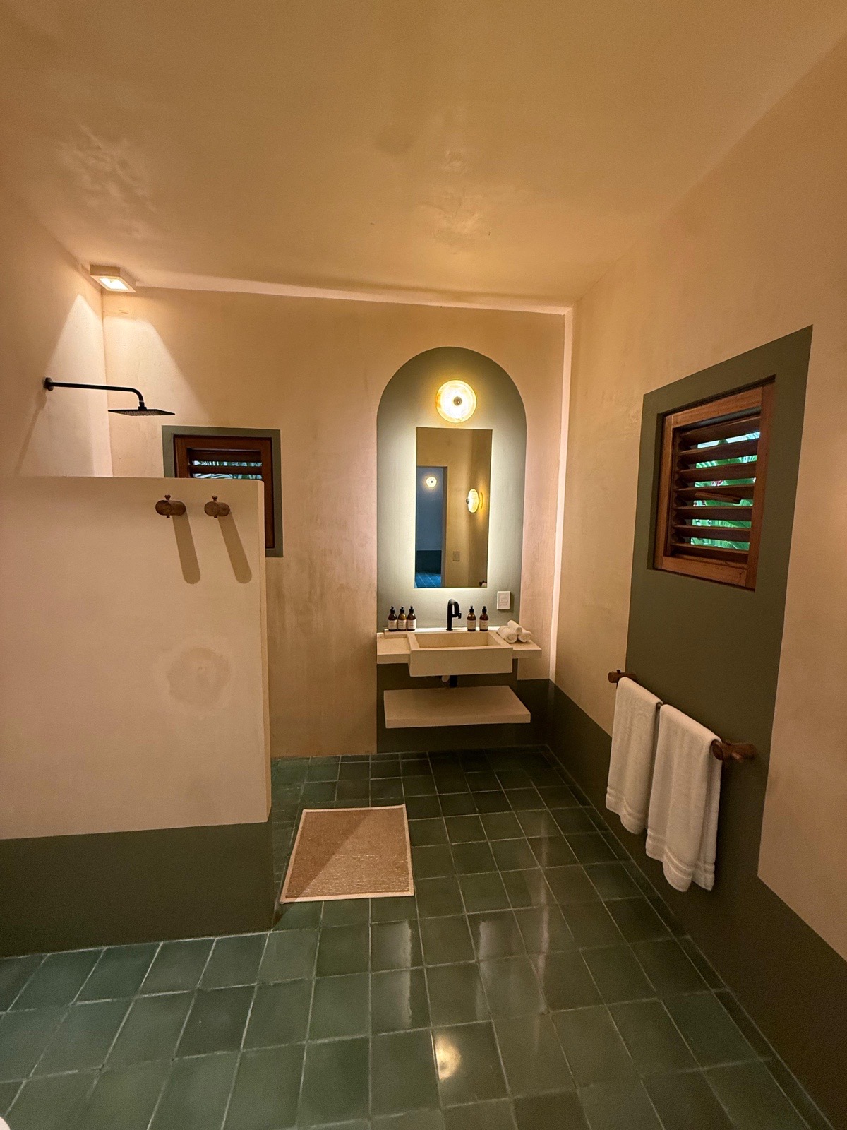 Bathroom — arched mirror & green tiles